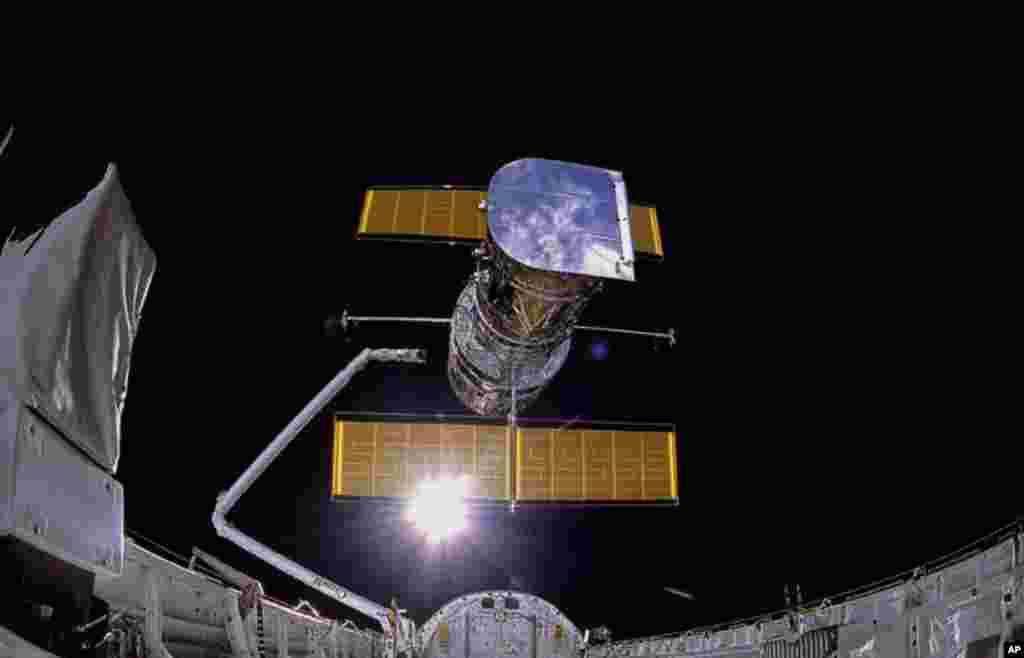 The Space Shuttle Discovery deploys the Hubble Space Telescope. April 24, 1990