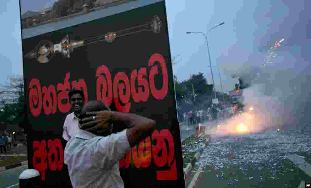 Supporters of Sri Lanka&rsquo;s President Mahinda Rajapaksa light firecrackers to celebrate after hearing the result of a vote to impeach the country&rsquo;s Chief Justice Shirani Bandaranayake in Colombo, Sri Lanka. Parliament voted overwhelmingly to impeach the justice, deepening a standoff between the judiciary and the government, which is controlled by the country's most powerful family. 