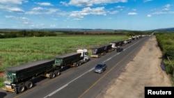 A drone view shows stranded trucks at the side of the road, near the Lebombo border outside Mbombela, South Africa, Nov. 29, 2024. Mozambique’s political instability has caused traffic congestion and delays at its borders, affecting neighboring areas. 