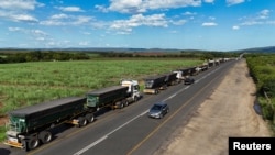 A drone view shows stranded trucks at the side of the road, near the Lebombo border outside Mbombela, South Africa, Nov. 29, 2024. Mozambique’s political instability has caused traffic congestion and delays at its borders, affecting trade. 