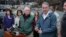 Interior Secretary Ryan Zinke, right, answers a reporters question after touring fire ravaged Paradise, Calif. with Agriculture Secretary Sonny Perdue, center, Nov. 26, 2018.