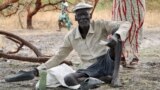 Gatdin Bol, 65, who fled fighting, sits under a tree in the town of Kandak, South Sudan. Five years into the country's civil war, more than 7 million people face severe hunger without food aid, the latest analysis by the U.N. and the government has found. 