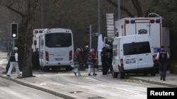 Forensic experts arrive near the site of last night's explosion in Ankara, Turkey, Feb. 18, 2016.