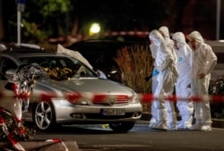 Forensics officers investigate at the scene after a shooting in central Hanau, Germany, Feb. 20, 2020. Several people were killed in shootings in Hanau on Wednesday evening, authorities said.