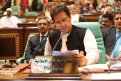 FILE - Pakistani Prime Minister Imran Khan attends a summit meeting of the 57-member Organization of Islamic Cooperation in the Saudi holy city of Mecca, June 1, 2019.