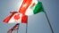 FILE - National flags representing the United States, Canada, and Mexico fly in the breeze, April 21, 2008.