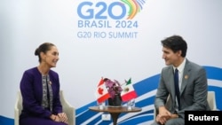 FILE - Mexico's President Claudia Sheinbaum, left, meets with the Canada's Prime Minister Justin Trudeau on the sidelines of the G20 Summit, in Rio de Janeiro, Nov. 18, 2024. (Mexico Presidency/Handout via Reuters)