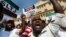 A group of Sri Lankan Muslims shout slogans, protesting against the UN and U.S resolution against Sri Lankan war crimes, during a demonstration as they march towards U.S embassy in Colombo, March 26, 2014. 