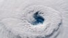 In this Sept. 12, 2018 photo provided by NASA, Hurricane Florence churns over the Atlantic Ocean heading for the U.S. east coast as seen from the International Space Station. Astronaut Alexander Gerst, who shot the photo, tweeted: "Ever stared down the gaping eye of a category 4 hurricane? It's chilling, even from space." (Alexander Gerst/ESA/NASA via AP)