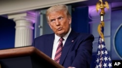 President Donald Trump pauses while speaking during a news conference at the White House, Sept. 27, 2020, in Washington.