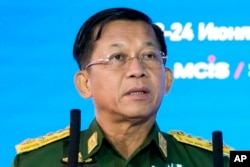 FILE - Myanmar junta leader Min Aung Hlaing delivers a speech in Moscow, Russia, on June 23, 2021.