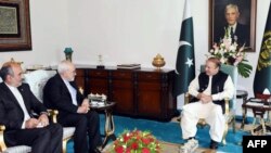In this handout photograph released by the Press Information Department (PID) on May 3, 2017, Pakistan's Prime Minister Nawaz Sharif (R) meets with Iranian Minister of Foreign affairs Mohammad Javad Zarif (2L) at the Prime Minister's House in Islamabad. 