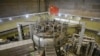 FILE - A Chinese flag is seen atop the Experimental Advanced Superconducting Tokamak (EAST), a nuclear fusion reactor in Hefei, Anhui province, China, Nov. 14, 2018. 