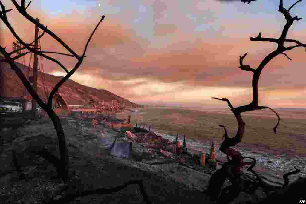 Burned-out beachfront homes destroyed by the Palisades Fire are seen along Pacific Coast Highway in Malibu, California, Jan. 10, 2025.