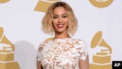 FILE - This Jan. 26, 2014 file photo shows Beyonce at the 56th annual Grammy Awards in Los Angeles.