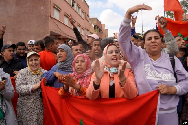 FILE - People displaced by the earthquake protest against lack of emergency assistance and worsening housing conditions in Amizmiz, outside Marrakech, Morocco, on Oct. 24, 2023.