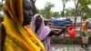 Women gather to collect water at the Yusuf Batil refugee camp in Upper Nile, South Sudan, July 4, 2012.