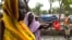 Women gather to collect water at the Yusuf Batil refugee camp in Upper Nile, South Sudan, July 4, 2012.