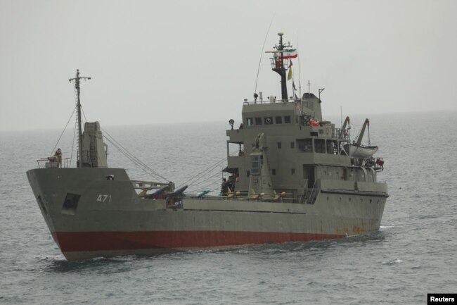 FILE - Drones stand at an Iranian military ship in the Indian Ocean in this handout image obtained on July 15, 2022. (Iranian Army/WANA Handout via REUTERS)