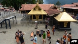 Indian Hindu devotees are pictured at the Lord Ayyappa temple at Sabarimala in the southern state of Kerala, Oct. 18, 2018.