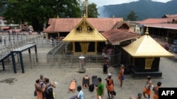 FILE - Indian Hindu devotees are pictured at the Lord Ayyappa temple at Sabarimala in the southern state of Kerala, Oct. 18, 2018.