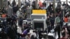 People go through security check at the entrance of a railway station during the annual Spring Festival travel rush ahead of the Chinese Lunar New Year, as the COVID-19 outbreak continues, in Shanghai, China Jan. 16, 2023. 