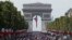 The crowd gathers to welcome the French soccer team for a parade a day after the French team victory in the soccer World Cup, July 16, 2018 in Paris. 