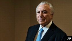 FILE - Brazil's then-President Michel Temer poses for a portrait at Four Seasons Hotel during the 73rd session of the United Nations General Assembly, Sept. 24, 2018, in New York. 