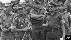 Maj. Gen. Suharto, 2nd left with sunglasses, is shown in this Oct. 6, 1965 file photo. The late dictator was an army general who crushed Indonesia's communist movement and pushed aside the country's founding father to usher in 32 years of tough rule.