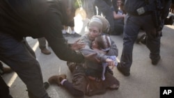 Israeli police evicts settlers from the West Bank settlement of Ofra, following the evacuation of Amona outpost, Feb. 2, 2017.