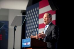 FILE - Democratic presidential candidate Mike Bloomberg holds a campaign rally in Salt Lake City, Utah, Feb. 20, 2020.