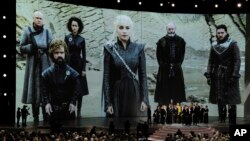 FILE - "Game of Thrones" cast and crew members accept the Emmy Award for Best Drama onstage at the 70th Primetime Emmy Awards in Los Angeles, Sept. 17, 2018.