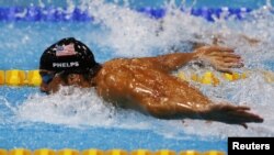 FILE - Michael Phelps of the U.S. swims the butterfly leg of the men's 4x100m medley relay final during the London 2012 Olympic Games, Aug. 4, 2012. 