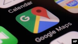 This photo taken March 22, 2017, shows the Google Maps app on a smartphone in New York. Google is enabling users of its digital mapping service to allow their movements to be tracked by friends and family in the latest test of how much privacy people are willing to sacrifice. 