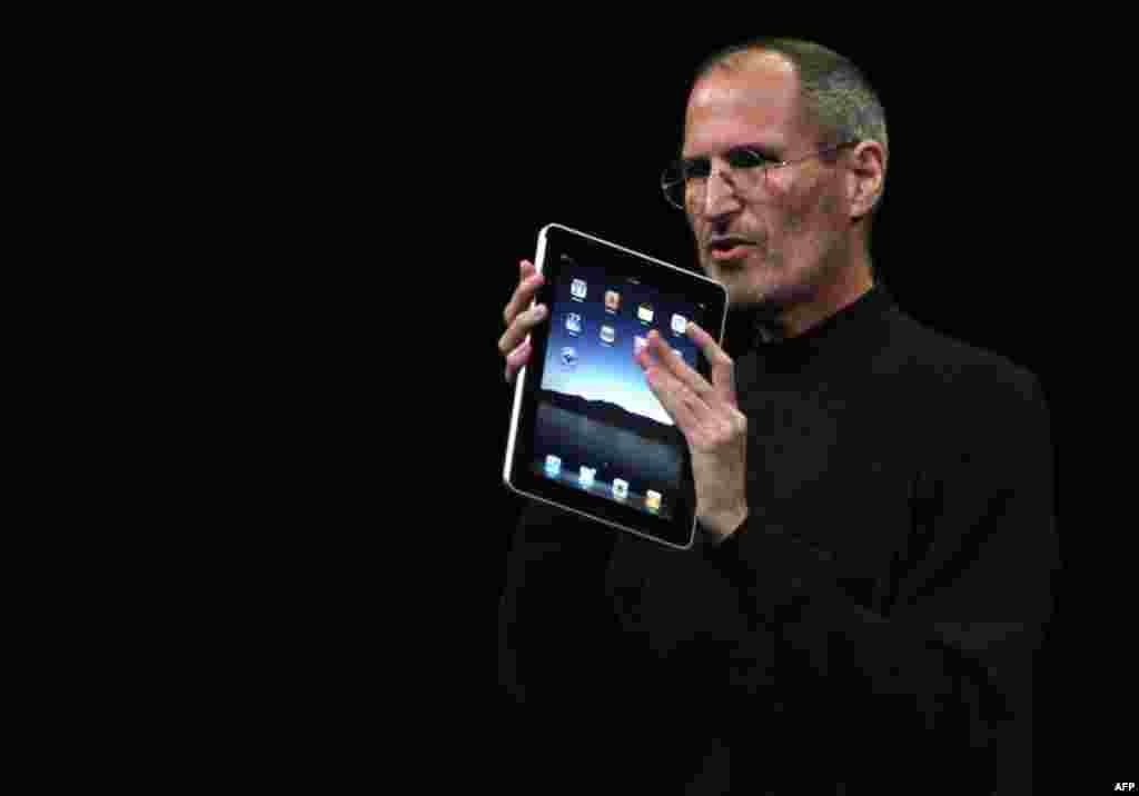January 27: Apple Chief Executive Officer Steve Jobs holds the new " iPad" during the launch of Apple's new tablet computing device in San Francisco, California. (Kimberly White/Reuters)