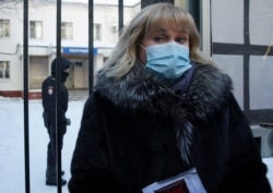 Olga Mikhailova, lawyer of Russian opposition leader Alexei Navalny, speaks to the media outside a police station where detained Navalny is being held, in Khimki, Russia, January 18, 2021.