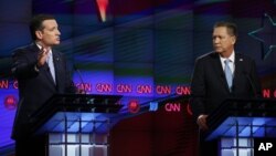 FILE - Republican presidential candidates, from left, Texas Senator Ted Cruz and Ohio Governor John Kasich participate in a Republican presidential debate at the University of Miami, in Coral Gables, Fla., March 10, 2016.