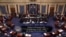 Image from video provided by C-SPAN2 shows the final Senate vote, with Vice President Mike Pence's vote, to start debate to tear down much of the Obama health care law, July 25, 2017, on the floor of the Senate on Capitol Hill in Washington.