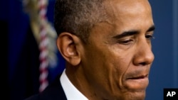 President Barack Obama pauses as he speaks in the White House briefing room in Washington about the Supreme Court decision on immigration, June 23, 2016.