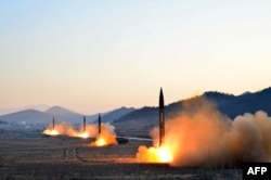 Undated photo released by North Korea's Korean Central News Agency (KCNA) via KNS on March 7, 2017 shows the launch of four ballistic missiles by the Korean People's Army (KPA) during a military drill at an undisclosed location in North Korea.