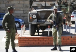 Army personnel man outside the military headquarters in Maseru, Lesotho, Aug. 31, 2014.