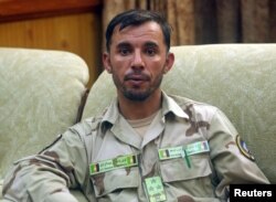 FILE - Gen. Abdul Razeq, who was killed in today's attack, is seen at his office in Kandahar province, Afghanistan, Aug. 4, 2016.