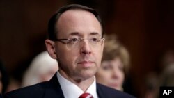 FILE - Then-Deputy Attorney General-designate Rod Rosenstein, appears on Capitol Hill in Washington, during his confirmation hearing before the Senate Judiciary Committee, March 7, 2017. 