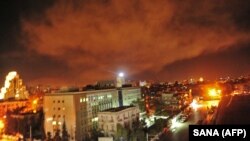 SYRIA – A photo released early on April 14, 2018 on the website of the official Syrian Arab News Agency shows an explosion on the outskirts of Damascus after Western strikes reportedly hit Syrian military bases and chemical research centres in and around
