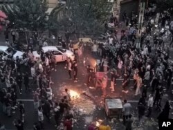 FILE - Iranians protest a 22-year-old woman Mahsa Amini's death after she was detained by the morality police, in Tehran, Sept. 20, 2022, in this photo taken by an individual not employed by the Associated Press and obtained by the AP outside Iran.