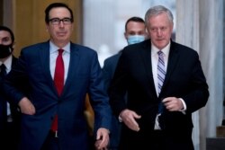 Treasury Secretary Steven Mnuchin, left, and White House Chief of Staff Mark Meadows, right, walk out of a meeting with House Speaker Nancy Pelosi and Senate Minority Leader Sen. Chuck Schumer, Aug. 7, 2020.