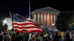 People gather at the Supreme Court in Washington, Saturday night, Sept. 19, 2020, to honor the late Justice Ruth Bader Ginsburg, one of the high court's liberal justices, and a champion of gender equality. Her death leaves a vacancy that could be…