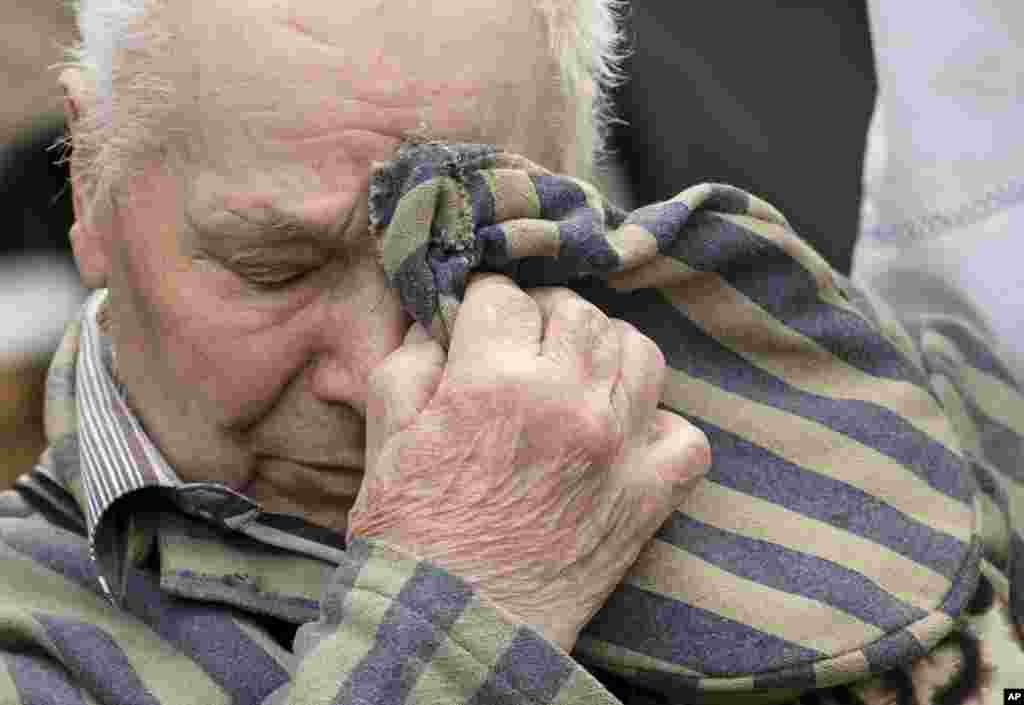 Former Nazi concentration camp survivor Petro Fedorowitsch Mischuk of Ukraine holds his uniform cap during the commemoration ceremonies for the 72th anniversary of the liberation of former Nazi concentration camp Mittelbau-Dora near Nordhausen, central Germany.