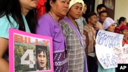 FILE - Karen activists in the northern province of Chiang Mai, hold a picture of Billy during a rally demanding authorities speed up the investigation and bring back their missing colleague Por Cha Lee Rakcharoen, known as "Billy" outside the governor's