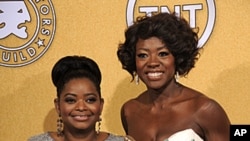 Octavia Spencer, winner of award for outstanding performance by a female actor in a supporting role for "The Help," left, and Viola Davis, winner of the award for outstanding performance by a female actor in a leading role for "The Help," pose backstage a